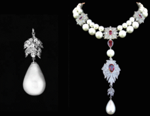La Peregrina pearl necklace with diamond and ruby accents alongside a matching earring.