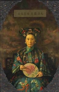 Portrait of Empress Dowager Cixi wearing traditional attire and holding a fan with a floral design.